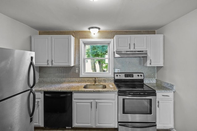 kitchen featuring white cabinets, backsplash, sink, and appliances with stainless steel finishes