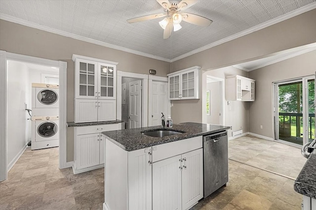 30 Whipple St, Worcester, MA 01607 - kitchen with dishwasher, stacked washing machine and dryer, a center island with sink, dark stone counters, and white cabinetry