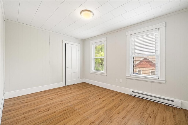 30 Whipple St, Worcester, MA 01607 - spare room featuring a baseboard heating unit and light wood finished floors