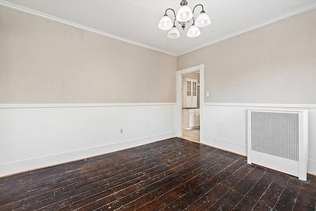 30 Whipple St, Worcester, MA 01607 - unfurnished room featuring radiator heating unit, a chandelier, wood-type flooring, wainscoting, and ornamental molding