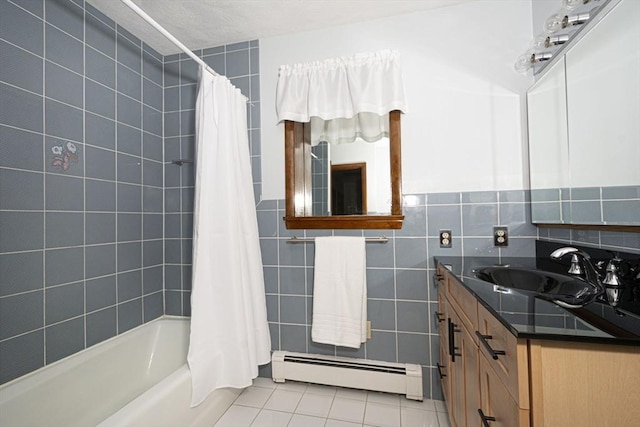 full bathroom with a baseboard radiator, tile patterned floors, shower / bath combo with shower curtain, tile walls, and vanity