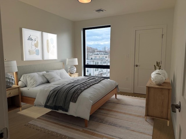 bedroom featuring visible vents