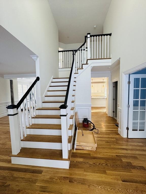 200A Randall Rd, Berlin, MA 01503 - stairs with a high ceiling and wood finished floors