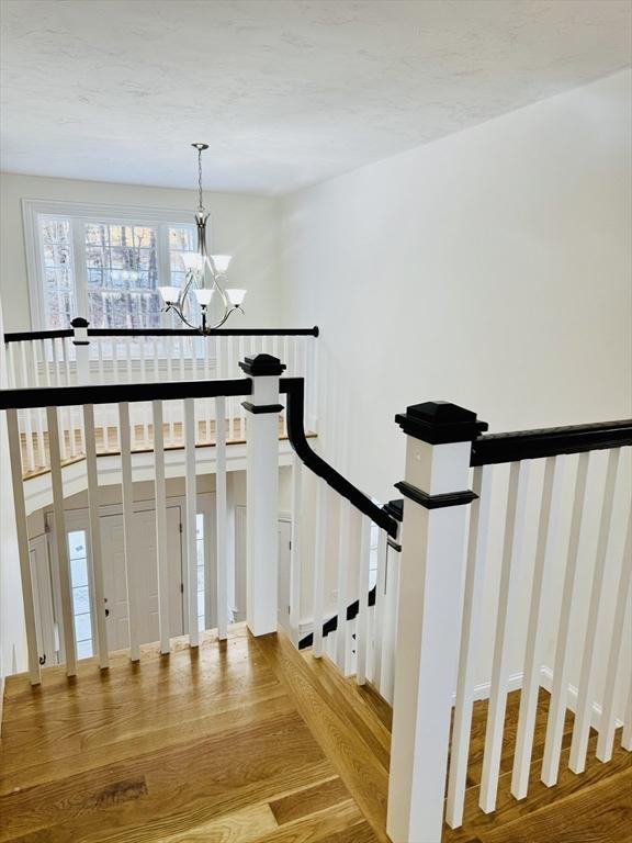 200A Randall Rd, Berlin, MA 01503 - stairs with a chandelier and wood finished floors