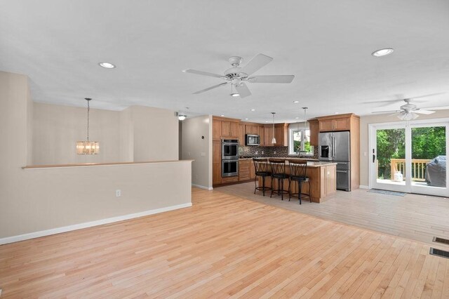 6 Myers Ln, Newbury, MA 01922 - kitchen with stainless steel appliances, baseboards, ceiling fan, open floor plan, and recessed lighting
