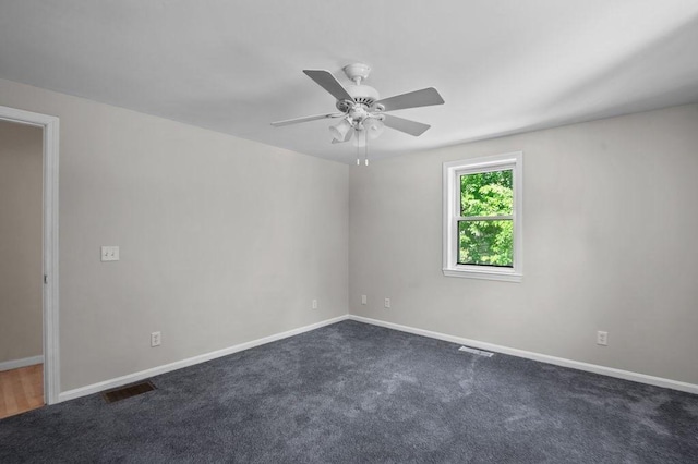 6 Myers Ln, Newbury, MA 01922 - spare room featuring baseboards, a ceiling fan, and dark colored carpet