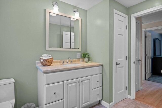 6 Myers Ln, Newbury, MA 01922 - bathroom featuring vanity, toilet, baseboards, and tile patterned floors