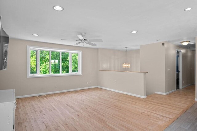 6 Myers Ln, Newbury, MA 01922 - unfurnished room with baseboards, light wood-type flooring, ceiling fan, recessed lighting, and a chandelier