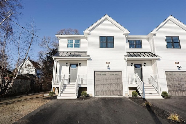 multi unit property featuring a garage