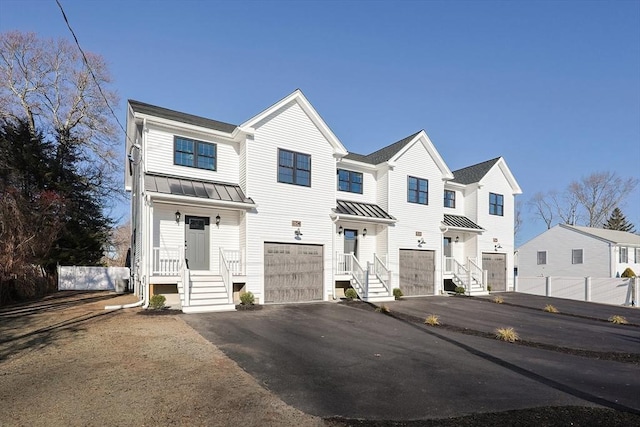 townhome / multi-family property featuring a garage