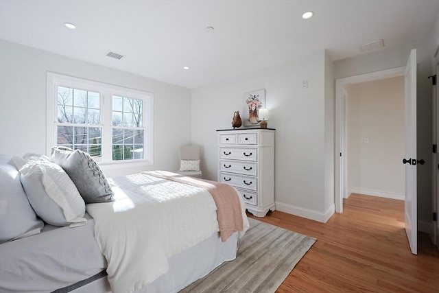 bedroom featuring light hardwood / wood-style floors