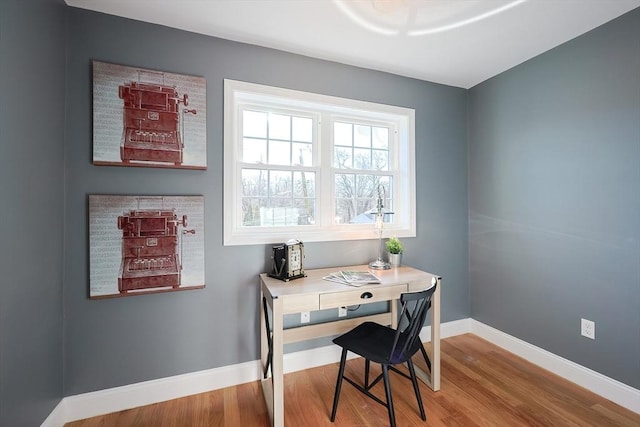 home office with hardwood / wood-style floors