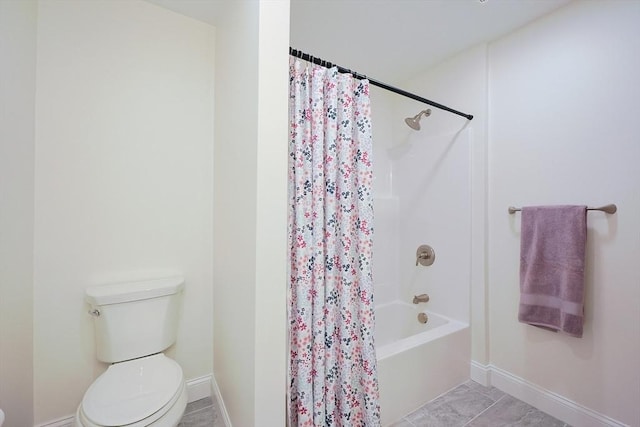 bathroom featuring tile patterned flooring, shower / bath combination with curtain, and toilet