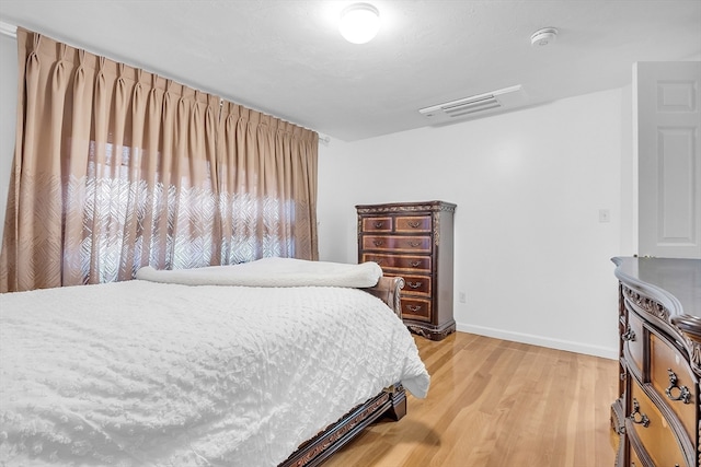 bedroom featuring wood-type flooring