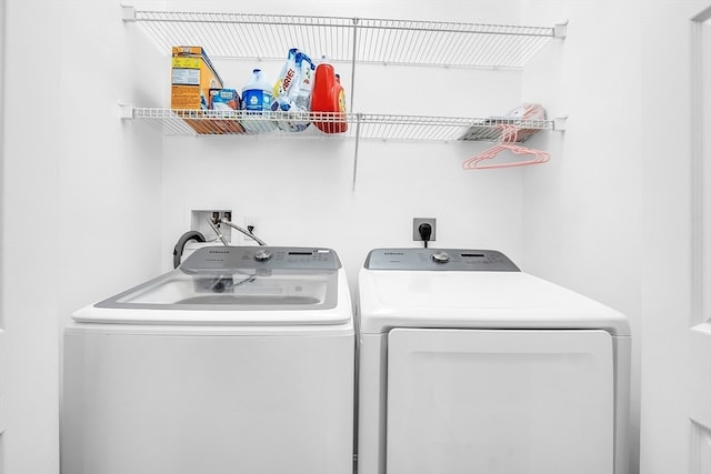 laundry area with independent washer and dryer