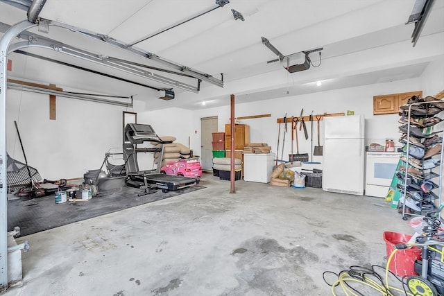 garage with white refrigerator and a garage door opener