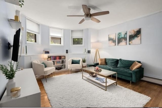 15 Trowbridge St Unit 12A, Cambridge, MA 02139 - living room featuring ceiling fan, wood finished floors, and a baseboard heating unit
