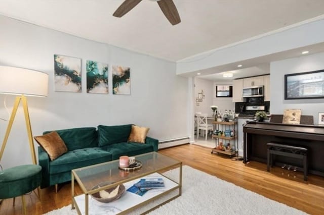15 Trowbridge St Unit 12A, Cambridge, MA 02139 - living room with a baseboard radiator, ceiling fan, wood finished floors, and recessed lighting