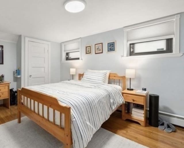 15 Trowbridge St Unit 12A, Cambridge, MA 02139 - bedroom featuring wood finished floors and baseboard heating