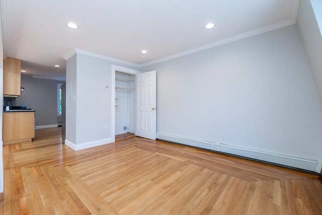 12 Springer St Unit 3, Boston, MA 02127 - unfurnished room featuring baseboard heating, light wood finished floors, recessed lighting, and crown molding