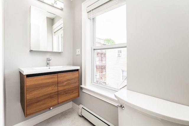 12 Springer St Unit 3, Boston, MA 02127 - bathroom featuring healthy amount of natural light, vanity, and a baseboard heating unit