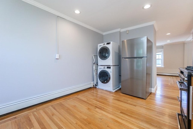 12 Springer St Unit 3, Boston, MA 02127 - washroom with stacked washer / drying machine, crown molding, light wood-type flooring, a baseboard heating unit, and recessed lighting