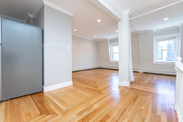 12 Springer St Unit 3, Boston, MA 02127 - spare room featuring a baseboard heating unit, electric panel, light wood-style flooring, ornamental molding, and recessed lighting