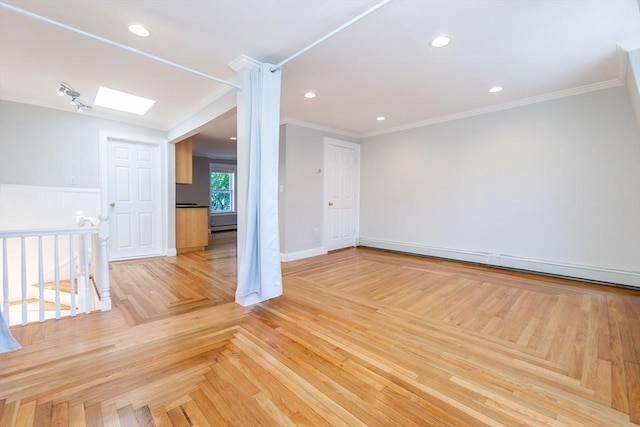 12 Springer St Unit 3, Boston, MA 02127 - empty room with a baseboard heating unit, crown molding, a skylight, and recessed lighting