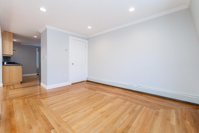 12 Springer St Unit 3, Boston, MA 02127 - empty room featuring a baseboard radiator, light wood finished floors, recessed lighting, and crown molding