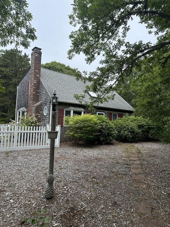 160 Toland Dr, Eastham, MA 02642 - view of property exterior with a chimney and roof with shingles