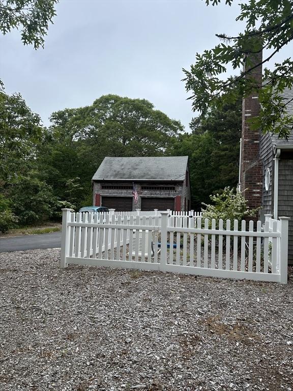 160 Toland Dr, Eastham, MA 02642 - view of yard featuring an outbuilding and a detached garage