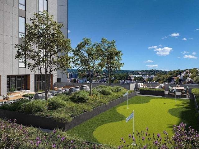 surrounding community with a putting green