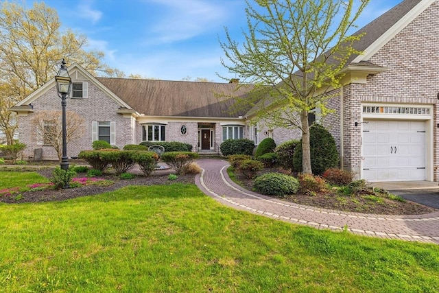 45 Joshua Rd, Wrentham, MA 02093 - view of front of property featuring brick siding, a front lawn, and an attached garage