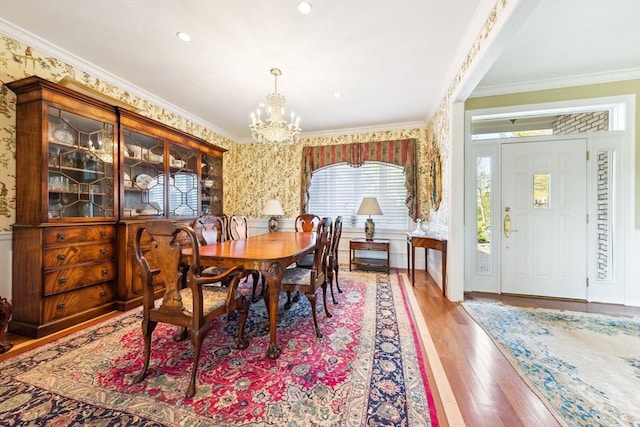 45 Joshua Rd, Wrentham, MA 02093 - dining room with a chandelier, wallpapered walls, ornamental molding, and wood finished floors