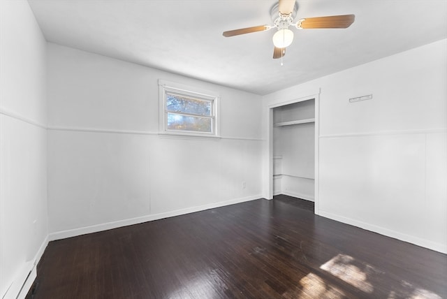 unfurnished bedroom featuring dark hardwood / wood-style floors, a closet, and ceiling fan