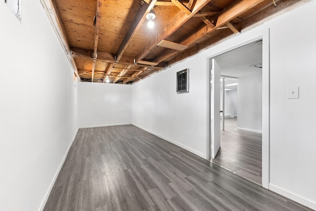 spare room with dark hardwood / wood-style floors