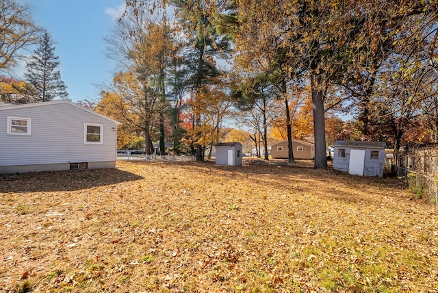 view of yard with a storage unit