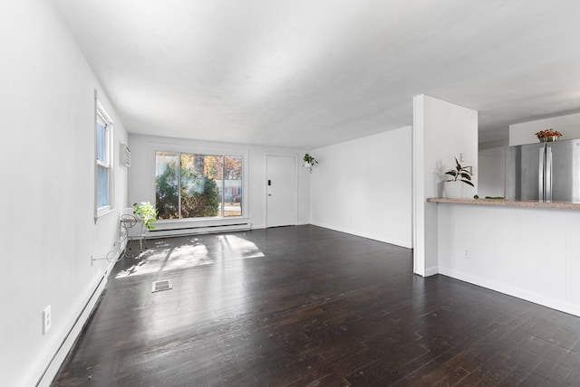 unfurnished living room with a baseboard radiator and dark hardwood / wood-style floors