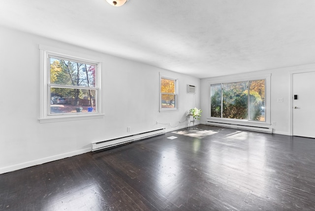 empty room with a baseboard radiator and dark hardwood / wood-style floors