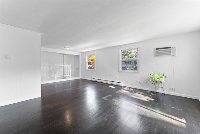 empty room with a baseboard radiator, a wall mounted air conditioner, and dark hardwood / wood-style floors