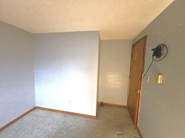 empty room with a textured ceiling