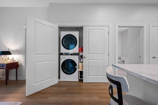 3302 Briarwood Vlg Unit 3302, Clinton, MA 01510 - laundry area featuring stacked washer / drying machine and wood finished floors