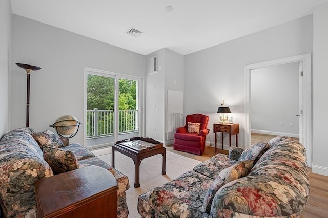 3302 Briarwood Vlg Unit 3302, Clinton, MA 01510 - living room featuring light wood finished floors and baseboards