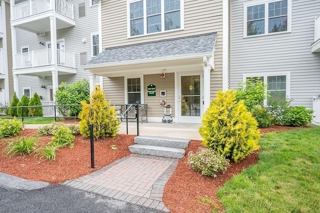 3302 Briarwood Vlg Unit 3302, Clinton, MA 01510 - doorway to property featuring a porch and roof with shingles