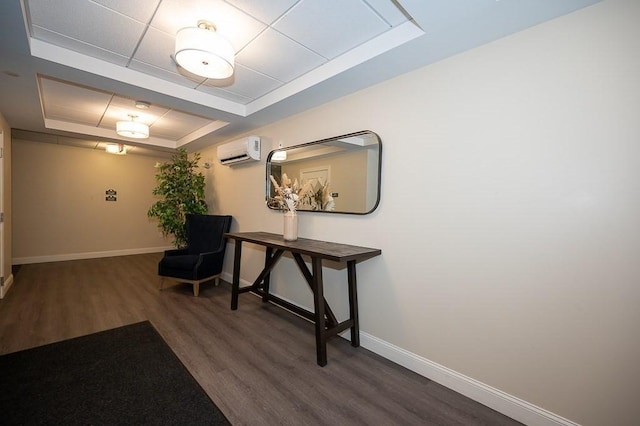 3302 Briarwood Vlg Unit 3302, Clinton, MA 01510 - corridor with a tray ceiling, a wall unit AC, and wood finished floors