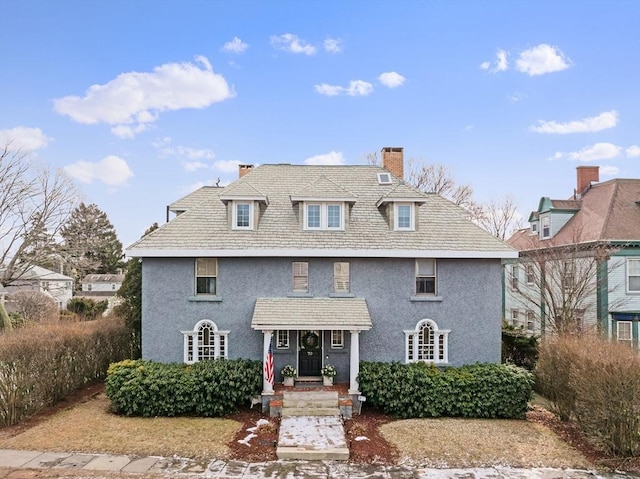 70 Hawthorn St, New Bedford, MA 02740 - georgian-style home featuring a chimney and stucco siding