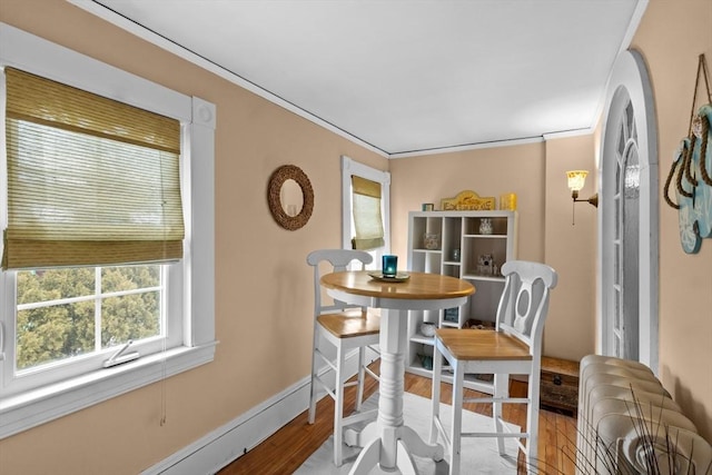70 Hawthorn St, New Bedford, MA 02740 - dining area with wood finished floors, crown molding, and baseboards