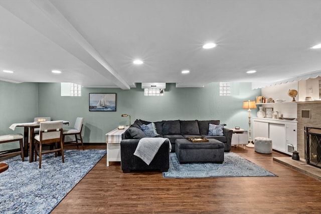 70 Hawthorn St, New Bedford, MA 02740 - living room with wood finished floors, healthy amount of natural light, recessed lighting, a fireplace with raised hearth, and baseboards