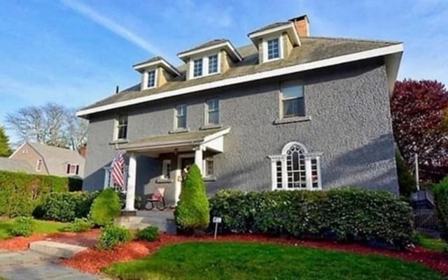 70 Hawthorn St, New Bedford, MA 02740 - view of front of home with a chimney and a front lawn