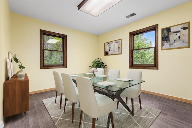 179 Rosemont St, Haverhill, MA 01830 - dining space with healthy amount of natural light, wood finished floors, and baseboards